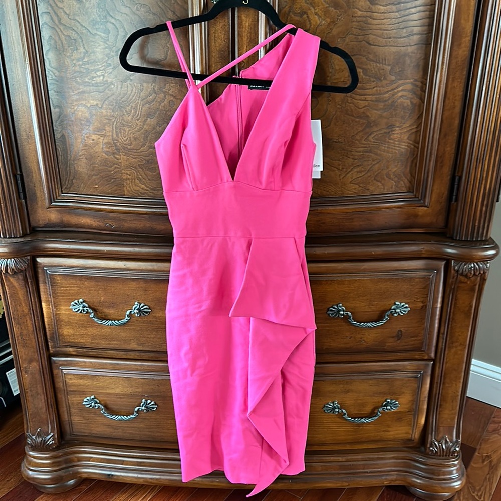 Beautiful asymmetric strappy pink dress. Back zip closure. Size 0. NWT.